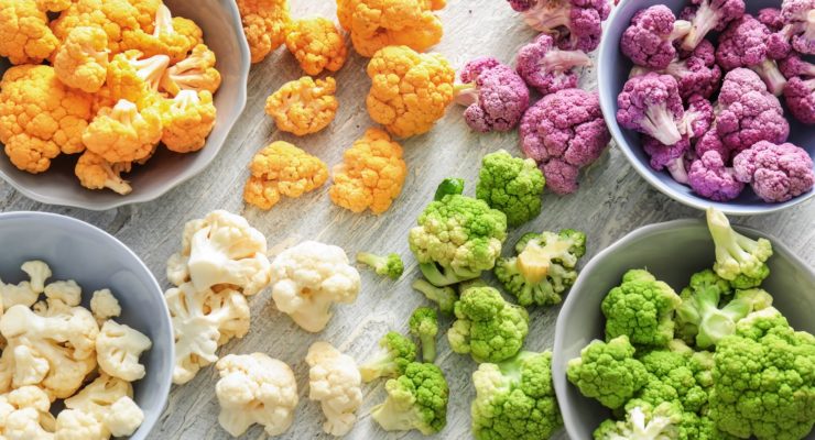 colorful cauliflower in four different bowls
