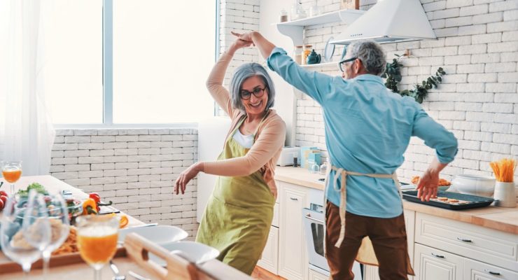 Man and woman dancing in a kitchen